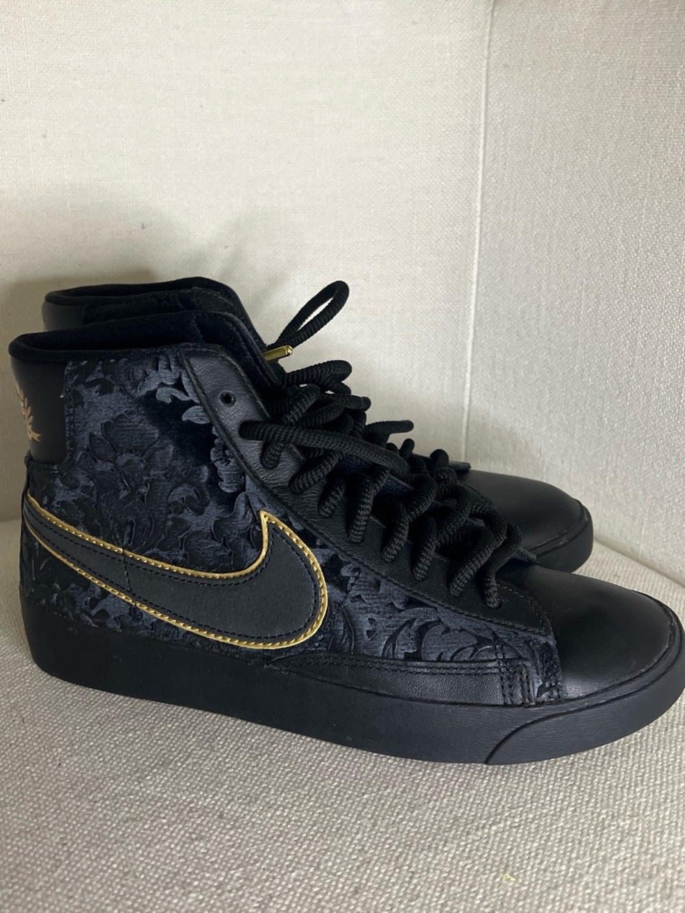 Nike Women's Black High-Top Sneakers with Gold Trim